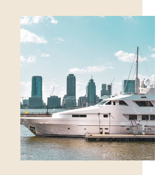 large boat at dock with a city in the background with 1 gold rings around the outside